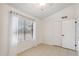 An empty bedroom featuring tile flooring, neutral paint, and natural lighting at 20644 N 30Th Dr, Phoenix, AZ 85027