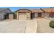 Charming single-story home with a desert landscape and a long driveway at 20644 N 30Th Dr, Phoenix, AZ 85027