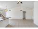 Spacious living area with tile flooring, ceiling fan, and easy access to the kitchen at 20644 N 30Th Dr, Phoenix, AZ 85027