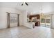 Open concept living room and kitchen area with ample natural light and tile floors at 20644 N 30Th Dr, Phoenix, AZ 85027
