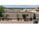 View of brick patio with trees, sculptures, and privacy fence, offering a secluded outdoor space at 21 W Cochise Dr, Phoenix, AZ 85021