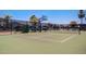 A basketball court with a hoop has a tall black fence and light posts, with parking nearby at 215 N Power Rd # 33, Mesa, AZ 85205