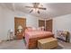 Cozy bedroom with ceiling fan, light-colored walls, and a comfortable king-size bed at 215 N Power Rd # 33, Mesa, AZ 85205