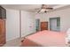 Bright bedroom with ceiling fan and wood furniture at 215 N Power Rd # 33, Mesa, AZ 85205