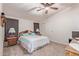 Bedroom features a ceiling fan, closet, and windows bringing in natural light at 215 N Power Rd # 33, Mesa, AZ 85205