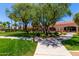 Community center with lush landscaping, mature trees, and outdoor seating at 215 N Power Rd # 33, Mesa, AZ 85205