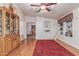 Charming dining room with hardwood floors and vintage display cabinet at 215 N Power Rd # 33, Mesa, AZ 85205