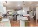 Kitchen with white cabinets, breakfast bar, stainless steel refrigerator and open design at 215 N Power Rd # 33, Mesa, AZ 85205