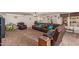 Spacious living room featuring a brown leather sofa and matching recliner at 215 N Power Rd # 33, Mesa, AZ 85205