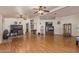Expansive living room with hardwood floors, ceiling fans and neutral paint at 215 N Power Rd # 33, Mesa, AZ 85205