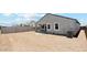 A spacious backyard, ready for landscaping and outdoor living, with ample potential for personalization at 2276 W Starfire Ave, Apache Junction, AZ 85120