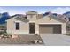 Charming single-story home with a two-car garage, desert landscaping, and stunning mountain views at 2276 W Starfire Ave, Apache Junction, AZ 85120
