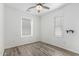 A well-lit room has two windows and a ceiling fan at 2308 E Aster Dr, Chandler, AZ 85286
