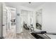 Bedroom featuring a total gym, mirror doors on a closet, wood-look floors, and a ceiling fan at 2308 E Aster Dr, Chandler, AZ 85286
