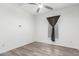 An airy room with a ceiling fan and window with woven wooden blinds at 2308 E Aster Dr, Chandler, AZ 85286