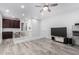 A spacious bonus room features wood-look flooring, and a view into the bedrooms from the stairwell at 2308 E Aster Dr, Chandler, AZ 85286