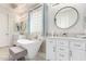Bright bathroom features dual vanity sinks, soaking tub, and modern fixtures at 2308 E Aster Dr, Chandler, AZ 85286