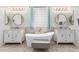 Well-lit bathroom features two vanities, a soaking tub, and plenty of counter space at 2308 E Aster Dr, Chandler, AZ 85286