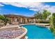 Beautiful pool area with a water feature, patio covering, multiple seating areas and lush landscaping at 2308 E Aster Dr, Chandler, AZ 85286