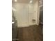A contemporary bathroom featuring a glass enclosed walk-in shower, white subway tile, and wood plank style flooring at 2425 W Bronco Butte Trl # 2028, Phoenix, AZ 85085