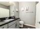 Bathroom showcasing a modern vanity, a toilet, a shower with a curtain and a tiled surround at 2425 W Bronco Butte Trl # 2028, Phoenix, AZ 85085
