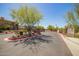 Elegant community entrance featuring lush landscaping, a gated entry, and well-maintained signage at 2425 W Bronco Butte Trl # 2028, Phoenix, AZ 85085