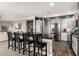 Open kitchen layout with stainless appliances, seating at the bar and an adjacent living space at 2425 W Bronco Butte Trl # 2028, Phoenix, AZ 85085
