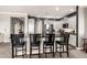 Modern kitchen featuring a large island with seating and stainless steel appliances at 2425 W Bronco Butte Trl # 2028, Phoenix, AZ 85085