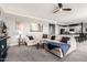 Open-concept living room featuring comfortable seating, plush carpet, and access to the kitchen at 2425 W Bronco Butte Trl # 2028, Phoenix, AZ 85085