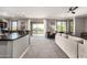 Open-concept living space with modern decor, carpet, and access to the outdoor balcony at 2425 W Bronco Butte Trl # 2028, Phoenix, AZ 85085