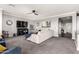 Stylish living room boasts plush seating, a modern ceiling fan, and decor at 2425 W Bronco Butte Trl # 2028, Phoenix, AZ 85085