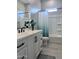 Well-lit bathroom featuring a single sink vanity with black hardware and a shower-tub combination at 25602 S 229Th Pl, Queen Creek, AZ 85142