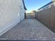 Wide paved driveway providing ample parking space, leading to a gate for privacy at 25602 S 229Th Pl, Queen Creek, AZ 85142