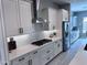 Modern kitchen with white cabinets, stainless steel appliances, and subway tile backsplash at 25602 S 229Th Pl, Queen Creek, AZ 85142