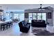 Inviting living room with open floor plan, stylish furniture, and access to the backyard at 25602 S 229Th Pl, Queen Creek, AZ 85142