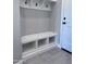 Functional mud room with built-in bench and storage, perfect for organizing shoes and coats at 25602 S 229Th Pl, Queen Creek, AZ 85142