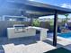 Outdoor kitchen featuring a built-in grill, counter space, and a pergola, perfect for outdoor dining at 25602 S 229Th Pl, Queen Creek, AZ 85142