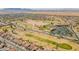 Picturesque aerial view showcases a desert community with a golf course and community amenities in Arizona at 2599 E San Mateo Dr, Casa Grande, AZ 85194