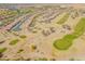 Stunning aerial view of desert community with golf course, landscaping, and well-maintained greenery in Arizona at 2599 E San Mateo Dr, Casa Grande, AZ 85194