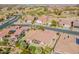 Panoramic aerial perspective highlighting the home's location and proximity to community amenities and golf course at 2599 E San Mateo Dr, Casa Grande, AZ 85194