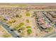 Expansive aerial view showcasing the community's layout, adjacent golf course, and neighborhood streets at 2599 E San Mateo Dr, Casa Grande, AZ 85194