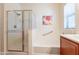 Bathroom features a shower with glass door and a relaxing soaking tub at 2599 E San Mateo Dr, Casa Grande, AZ 85194