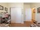 Neutral bedroom showcasing closet and hallway doors, with a shelf for storage at 2599 E San Mateo Dr, Casa Grande, AZ 85194