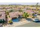 Inviting front exterior features desert landscaping, a two-car garage, and a well-maintained lawn at 2599 E San Mateo Dr, Casa Grande, AZ 85194