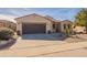 Exterior view of a single-Gathering home boasting well-manicured landscaping, a two-car garage, and a clean facade at 2599 E San Mateo Dr, Casa Grande, AZ 85194