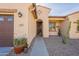 Inviting front entrance with desert landscaping, walkway, and decorative details; house number clearly displayed above the door at 2599 E San Mateo Dr, Casa Grande, AZ 85194