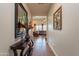 Open hallway leads to a spacious living room, adorned with stylish decor and a view of the backyard at 2599 E San Mateo Dr, Casa Grande, AZ 85194