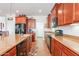 Kitchen featuring stainless steel appliances, ample cabinetry, and island bar at 2599 E San Mateo Dr, Casa Grande, AZ 85194