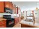 Kitchen with stainless steel sink, black appliances, and granite counters at 2599 E San Mateo Dr, Casa Grande, AZ 85194