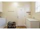 Laundry room with washer, dryer, freezer and exterior door at 2599 E San Mateo Dr, Casa Grande, AZ 85194
